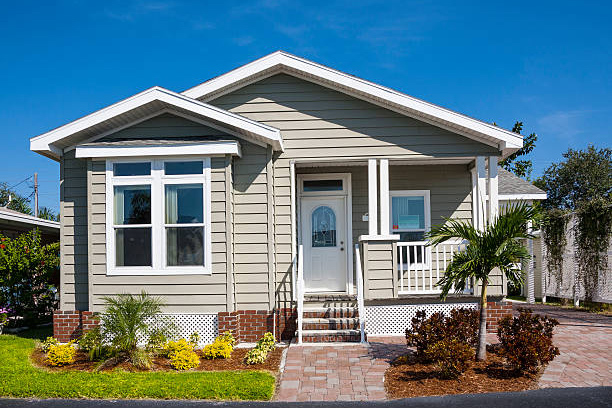 small bungalow with green siding